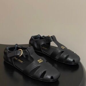 Miu Miu Black Leather T-Strap Fisherman Sandals with Gold Logo